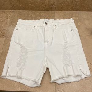 Good American distressed white shorts